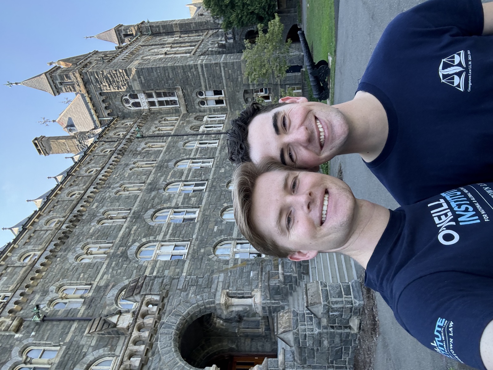 Lach and Bryce smiling in front of Healy Hall at Georgetown University in Washington, DC